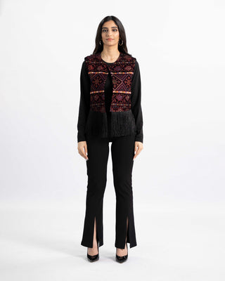 Detail of tatreez embroidery and fringe hem on the Bedouin Jewel velvet vest — ASHI