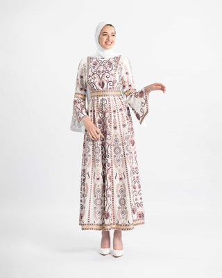 Model in a white and purple embroidered Palestinian kaftan with bell sleeves and a gold belt — ASHI