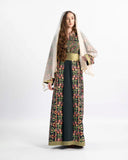Model in the Jerusalem Celestial Harmony embroidered Palestinian thobe — ASHI