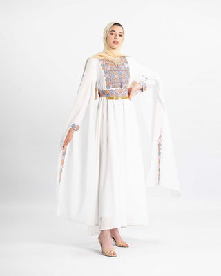 Model in the Mountain Mist embroidered Palestinian henna dress with flowing chiffon sleeves — ASHI