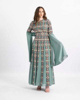 Model in the Mystic Cascades embroidered Palestinian thobe with long sleeves — ASHI