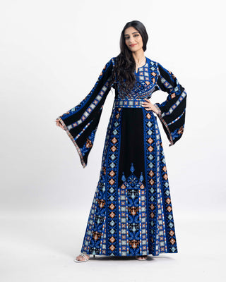 Model in the Whispering Waves Palestinian thobe with blue Qalqilya tatreez embroidery — ASHI